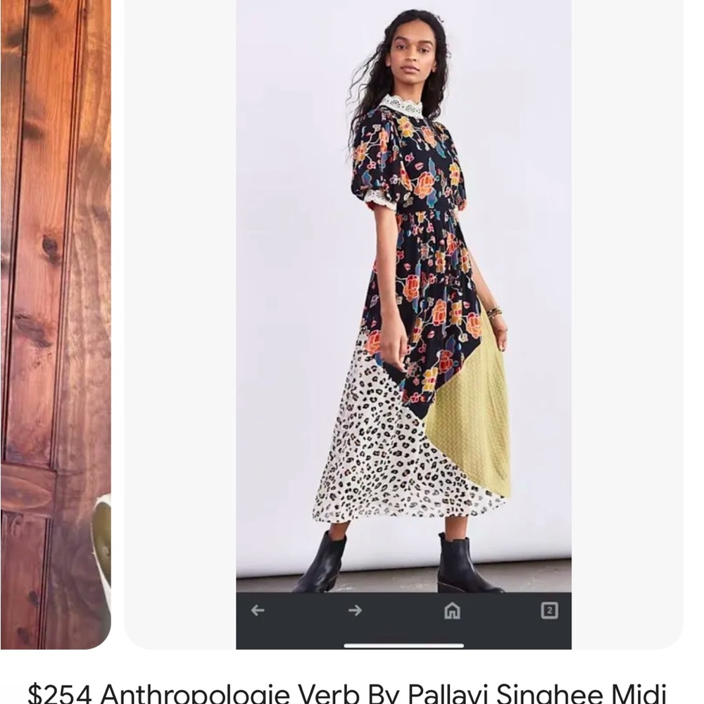 Beautiful new with tagss Anthro dress. Black motif mixed patterned dress .